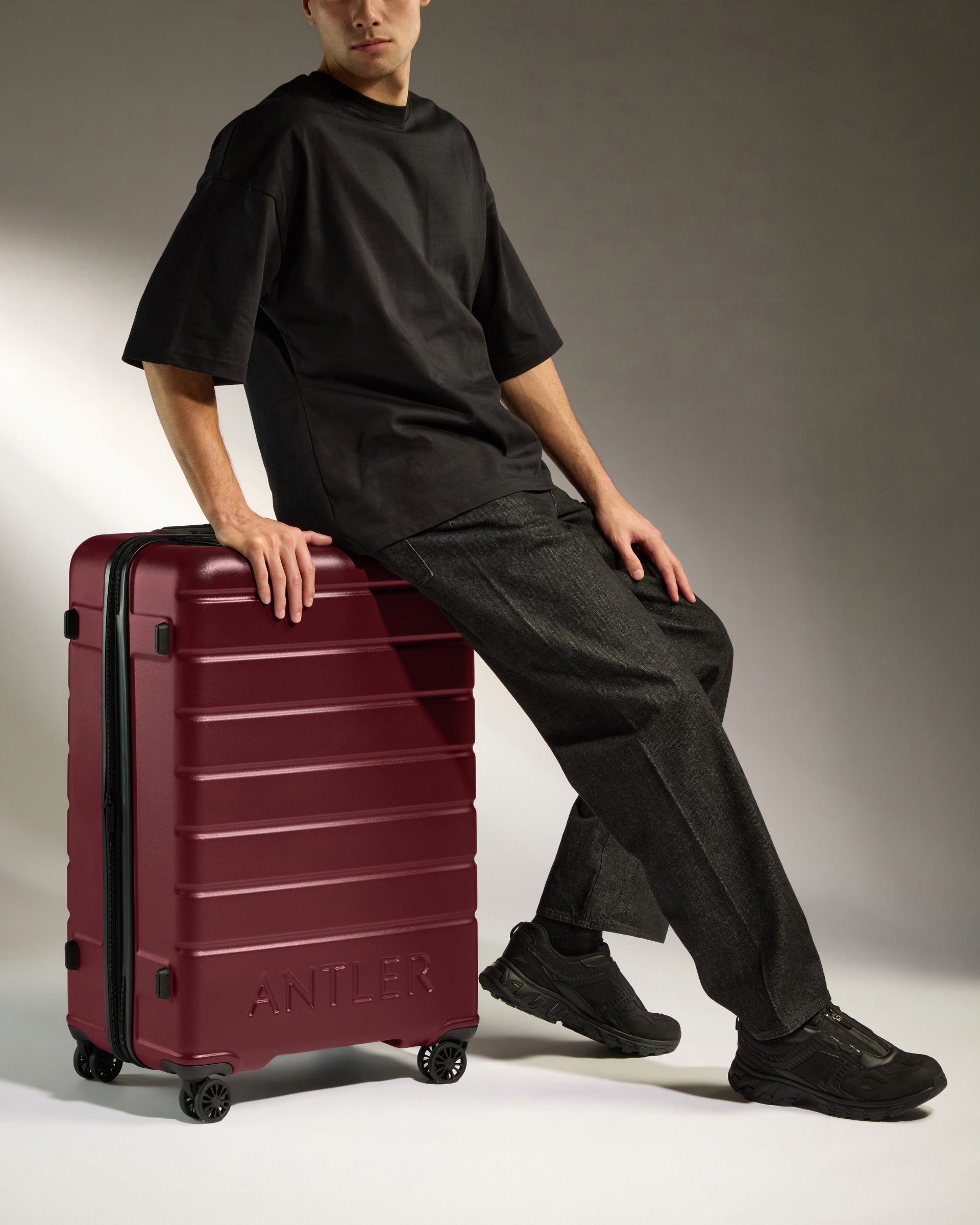 a man sitting on a luggage