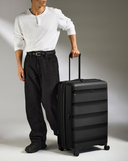 Large Luggage in Black - Logo Stripe