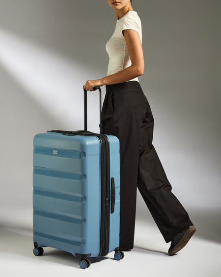 Large Luggage in Light Blue - Logo Stripe