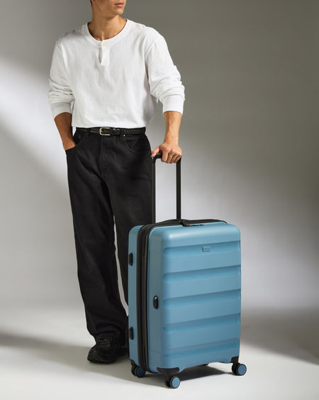 Medium Luggage in Light Blue - Logo Stripe