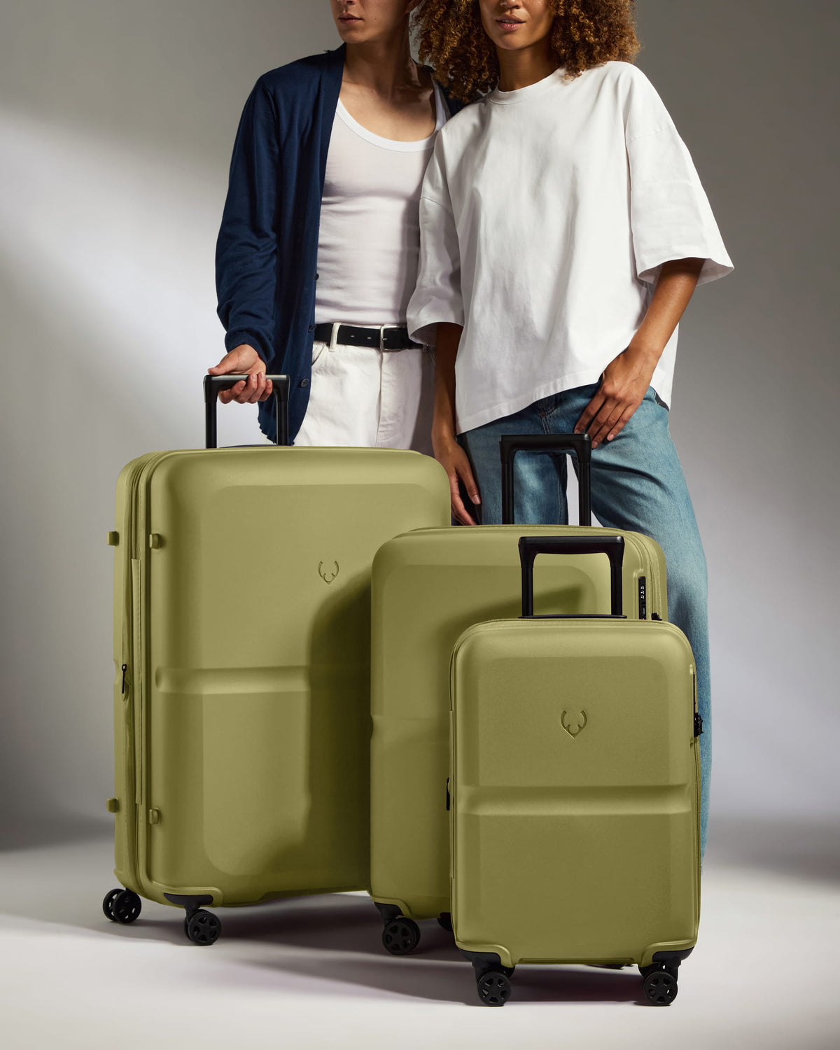 a couple of people standing next to luggage