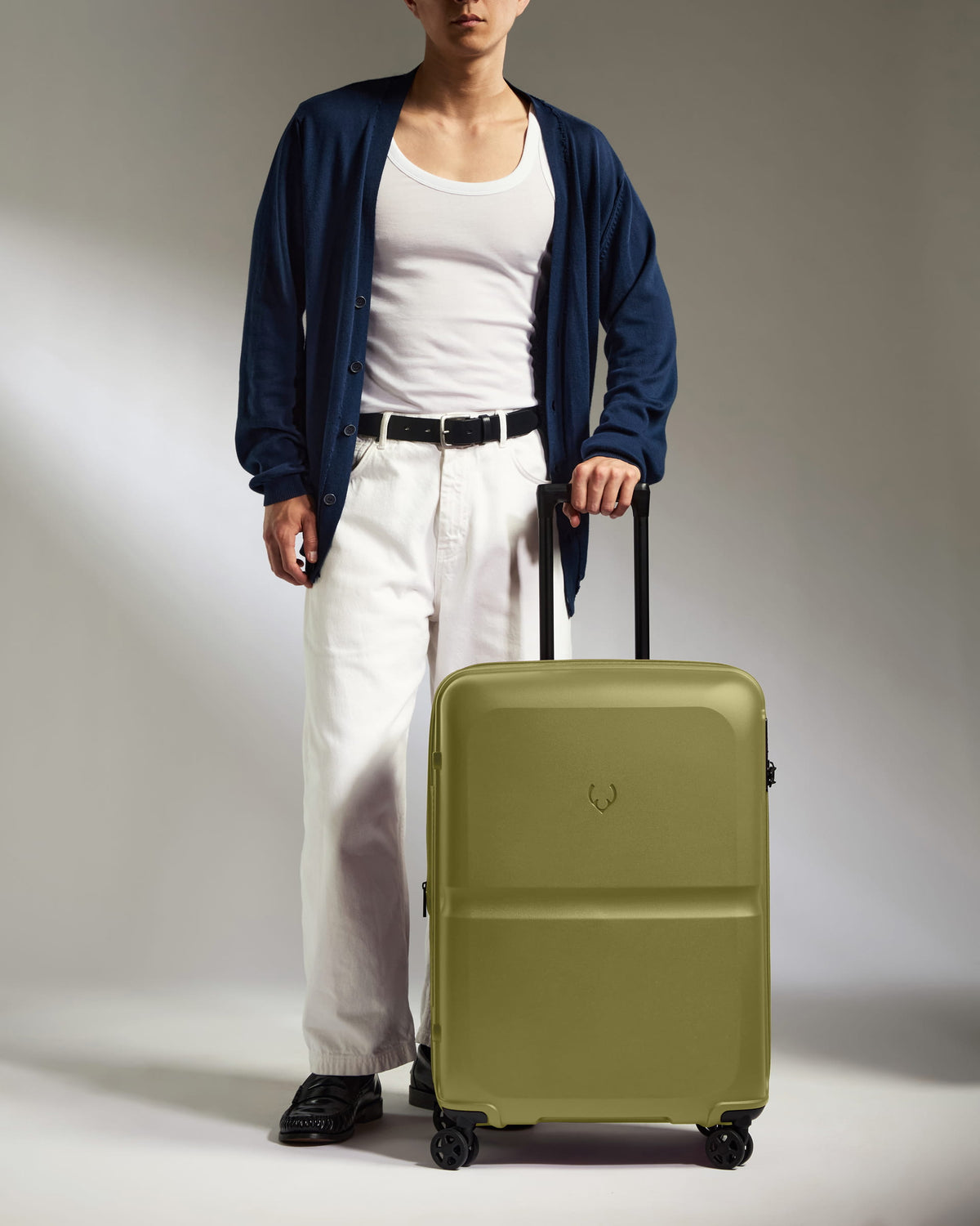 a man standing with a suitcase
