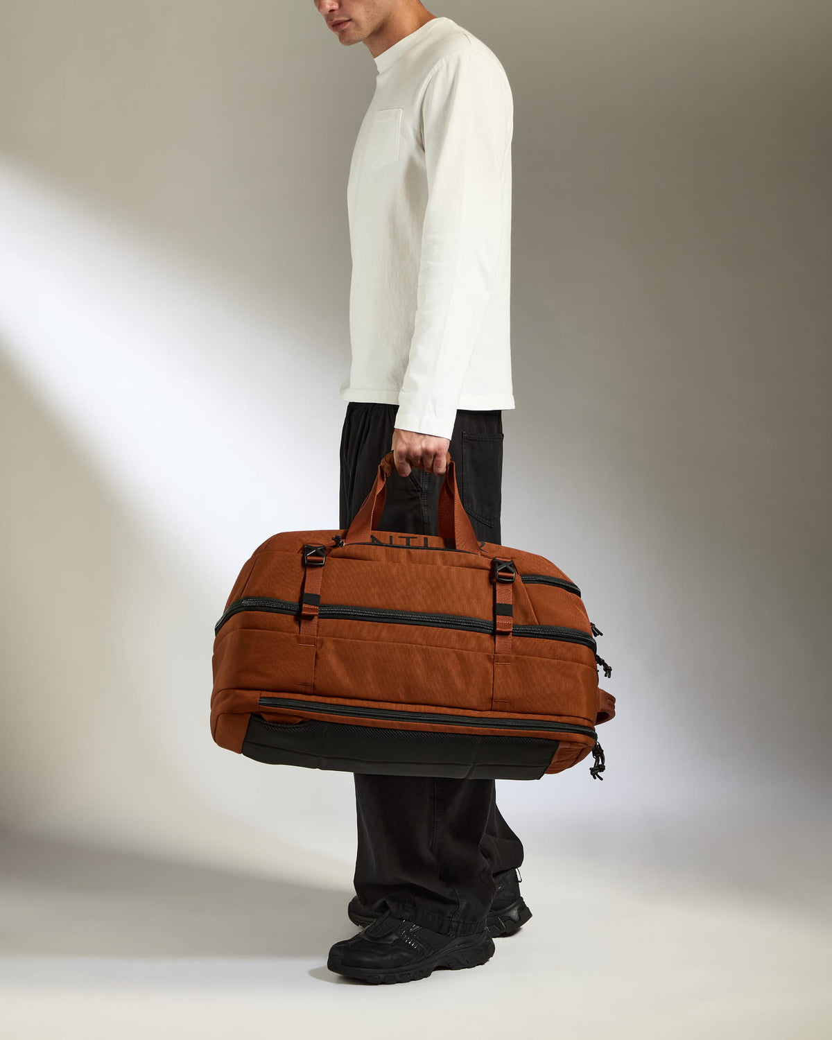 a person holding a brown bag