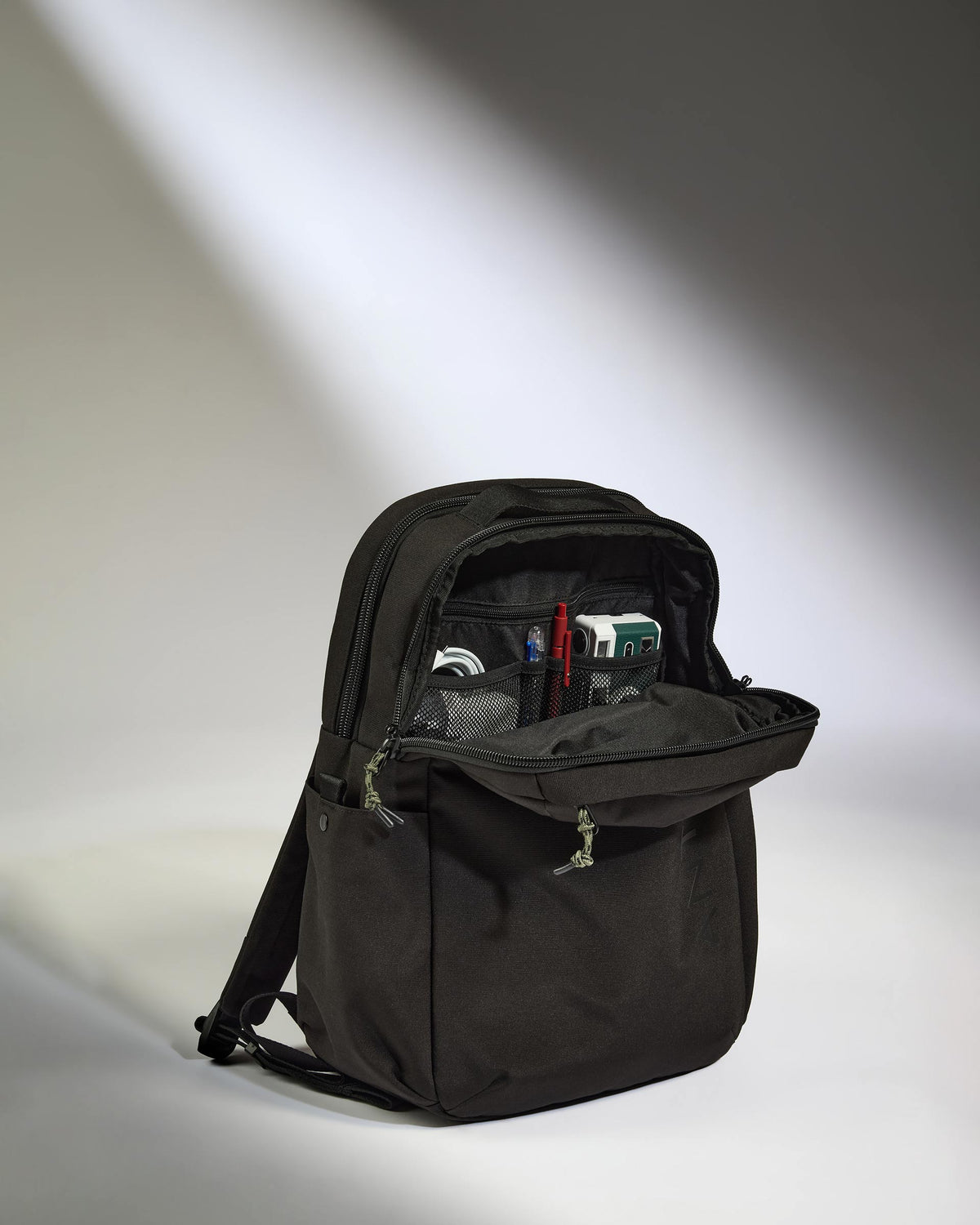 a black backpack with a zipper
