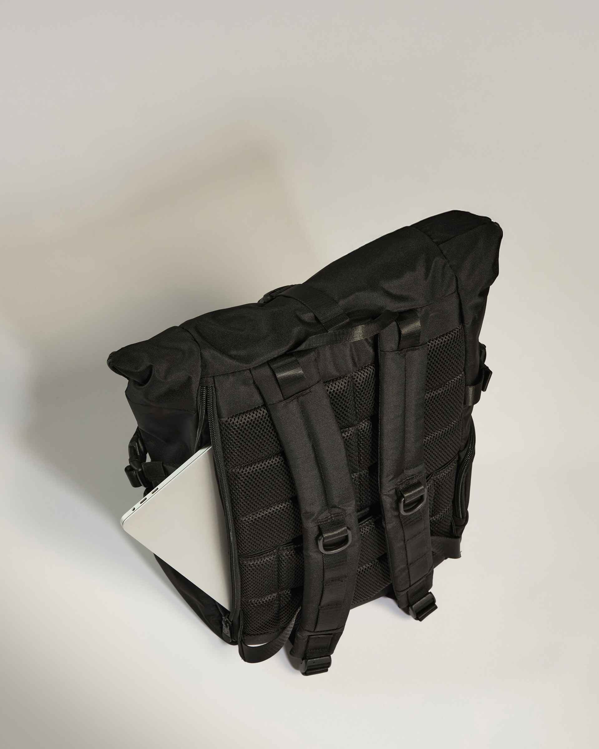 a black backpack with a white object in the pocket