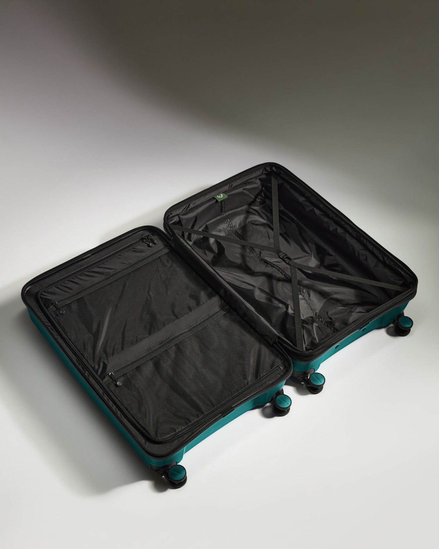 Large Luggage in Deep Teal - Logo Stripe