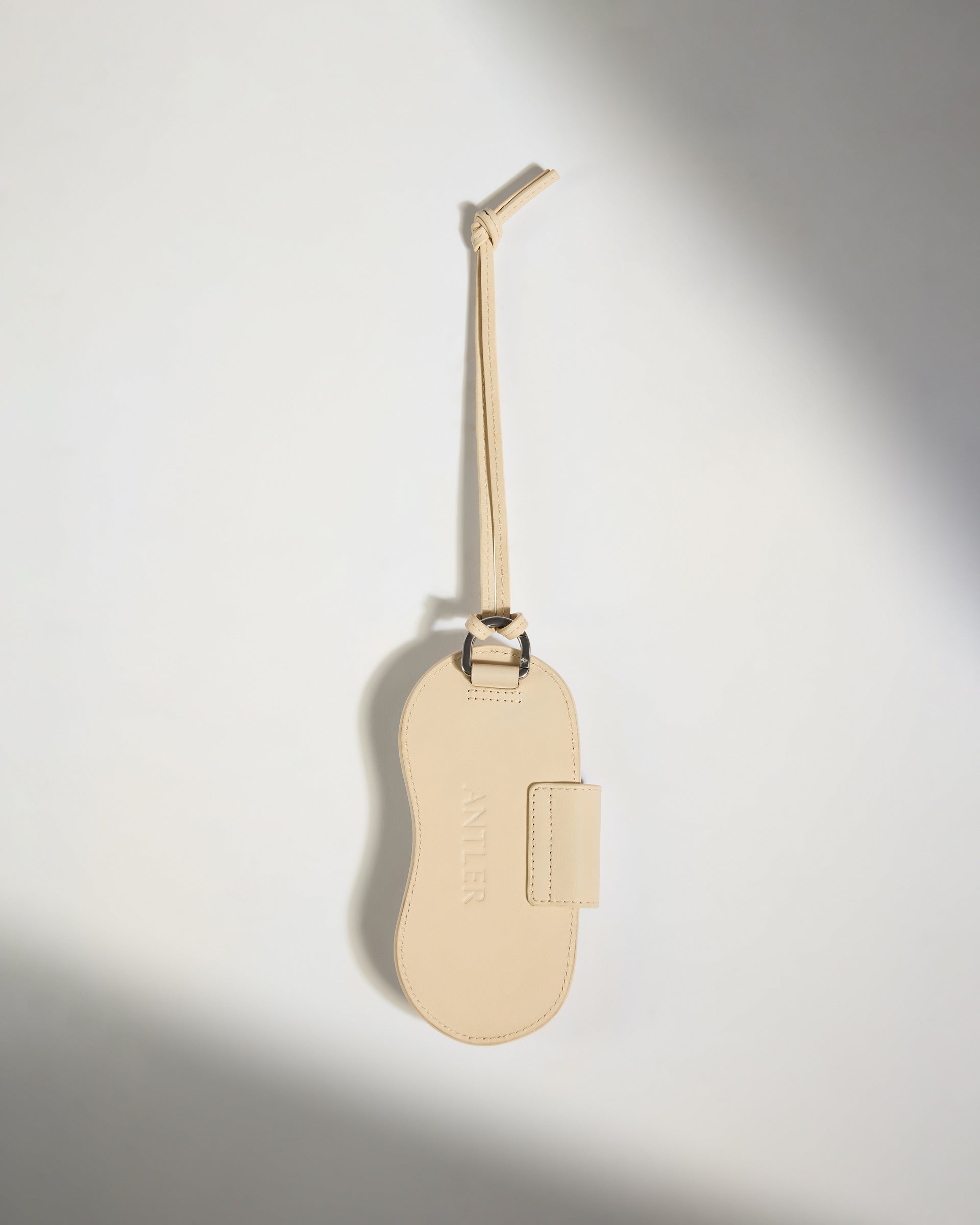 a tan leather luggage tag