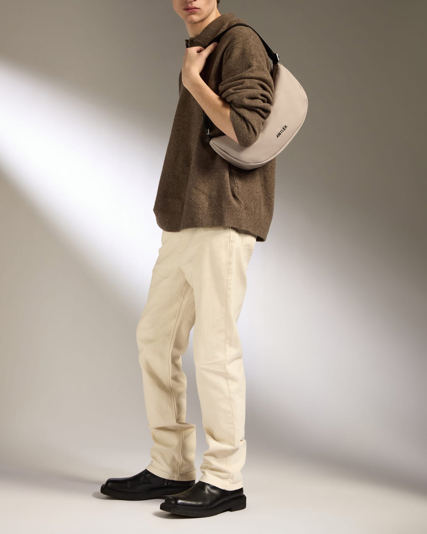 a man with a bag on his shoulder