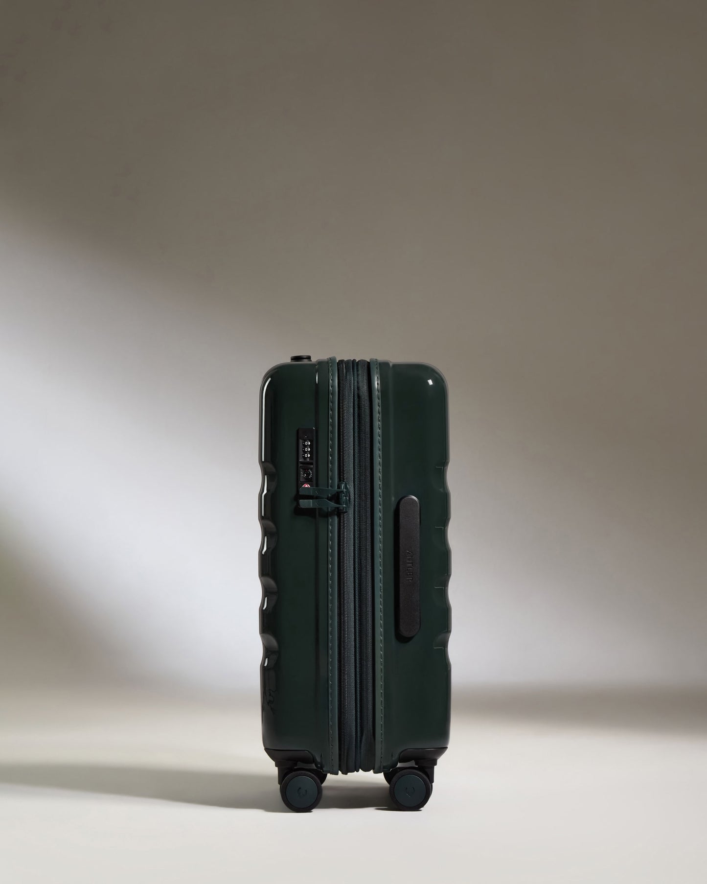 a green suitcase with wheels
