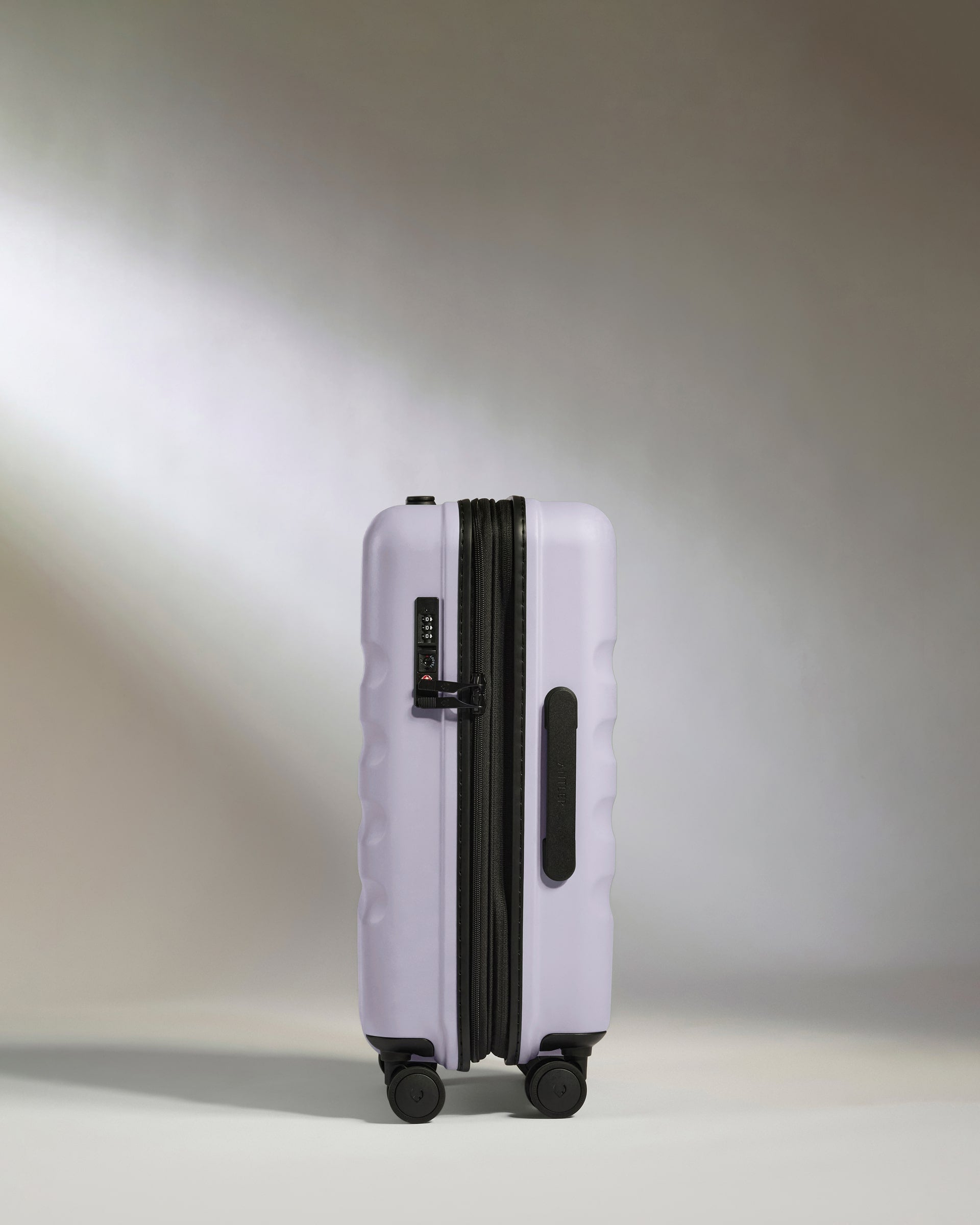 a purple suitcase with wheels