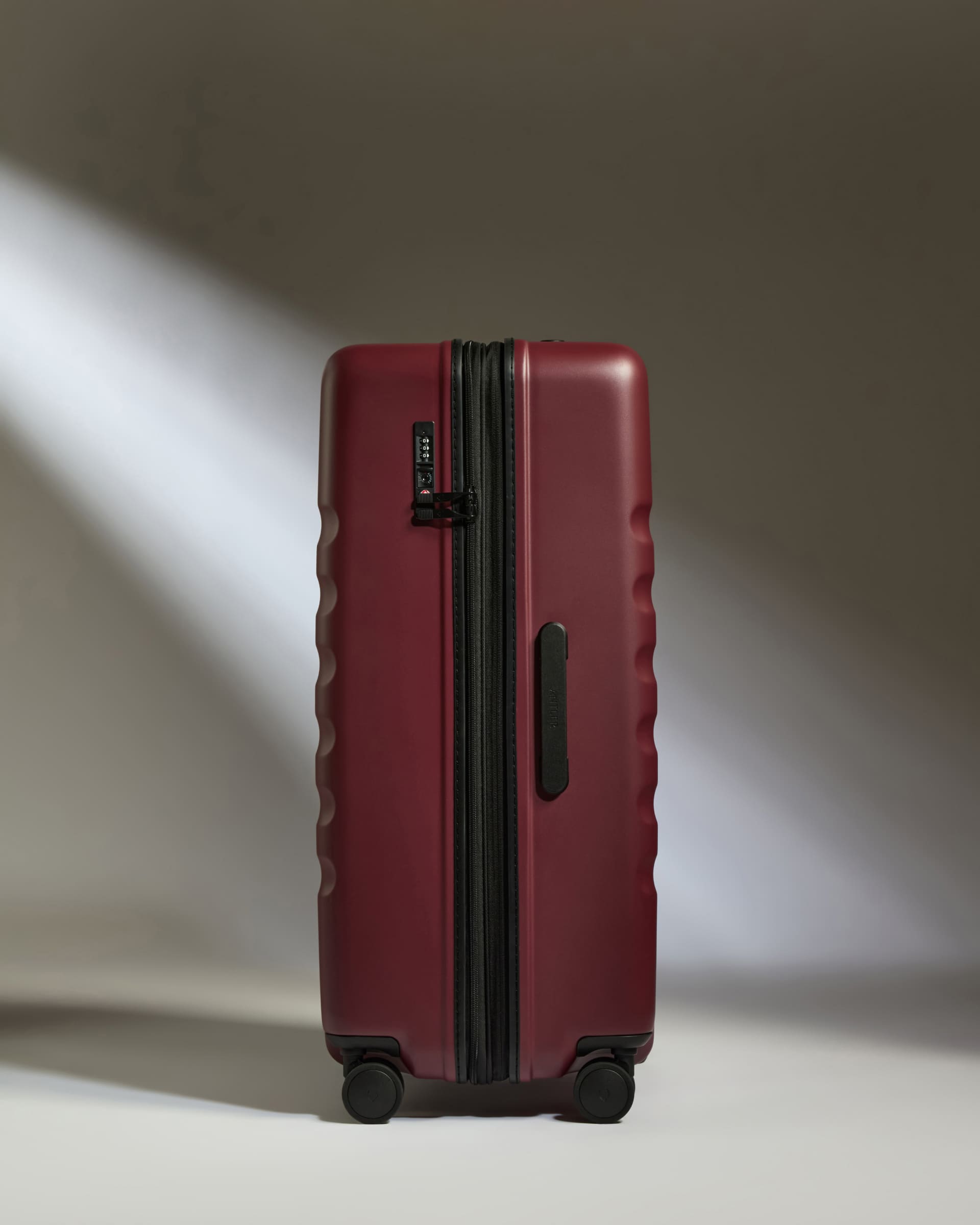 a red suitcase with wheels