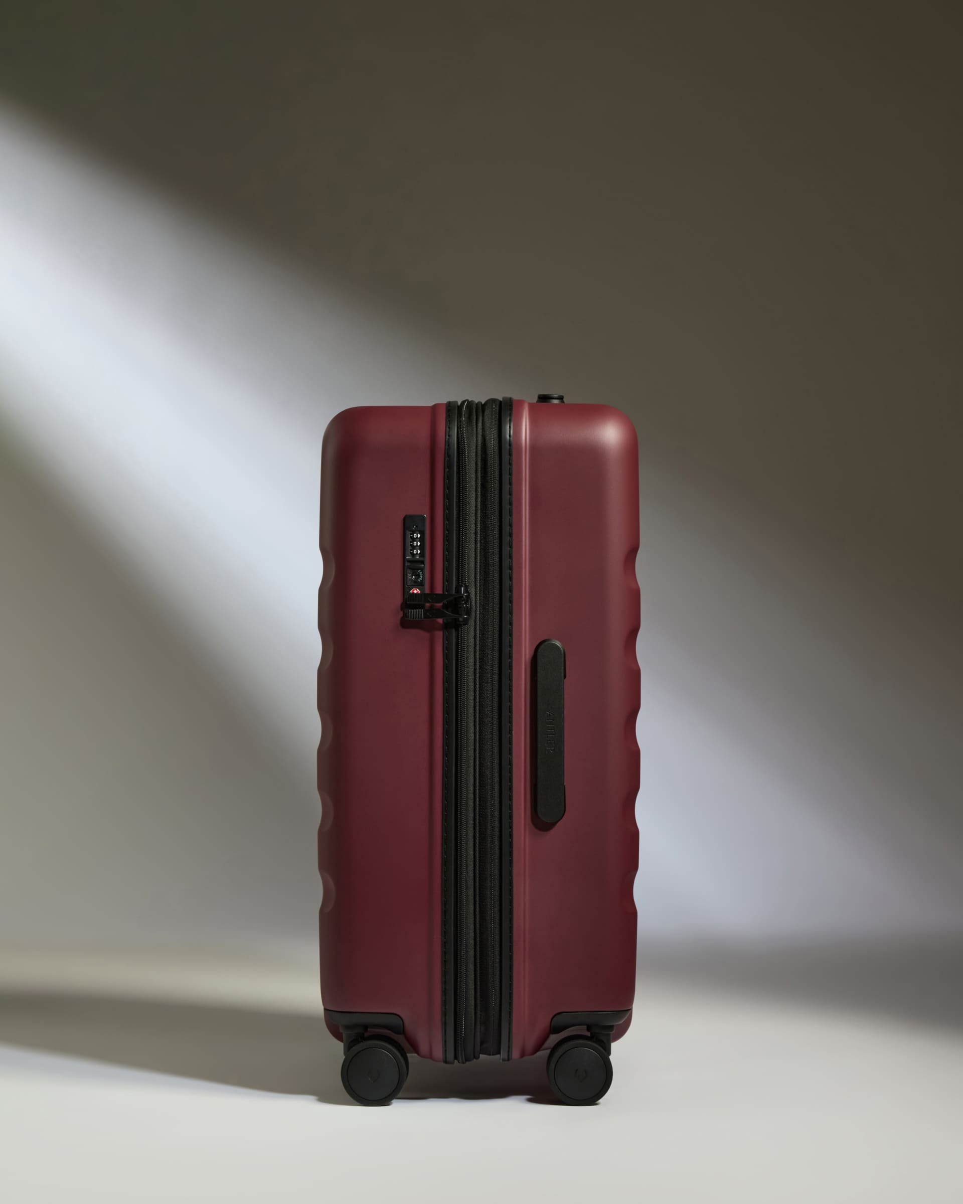 a red suitcase with wheels