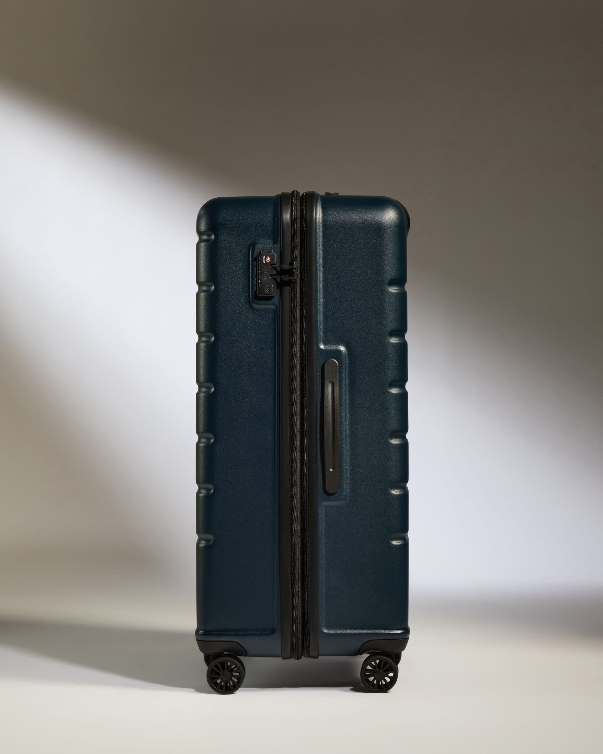 a blue suitcase with wheels