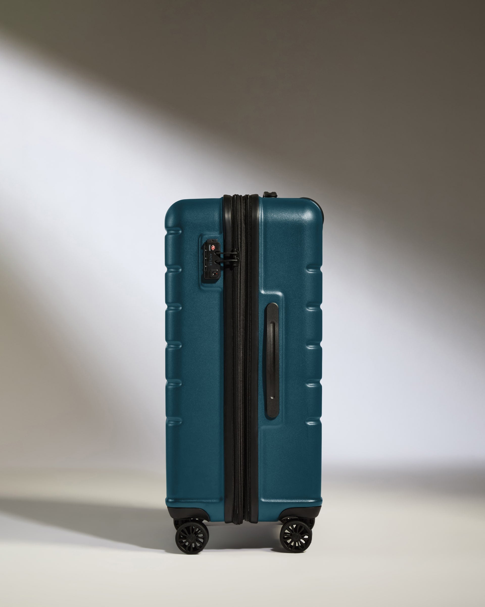 a blue suitcase with wheels
