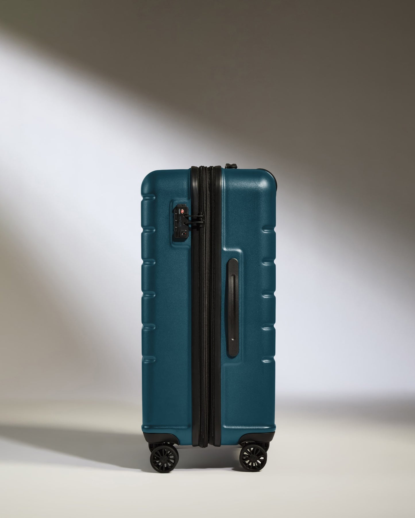 a blue suitcase with wheels