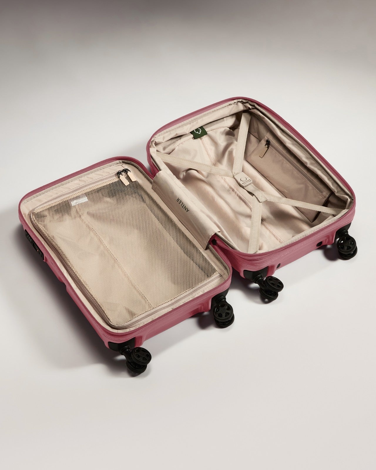 a pink suitcase with wheels