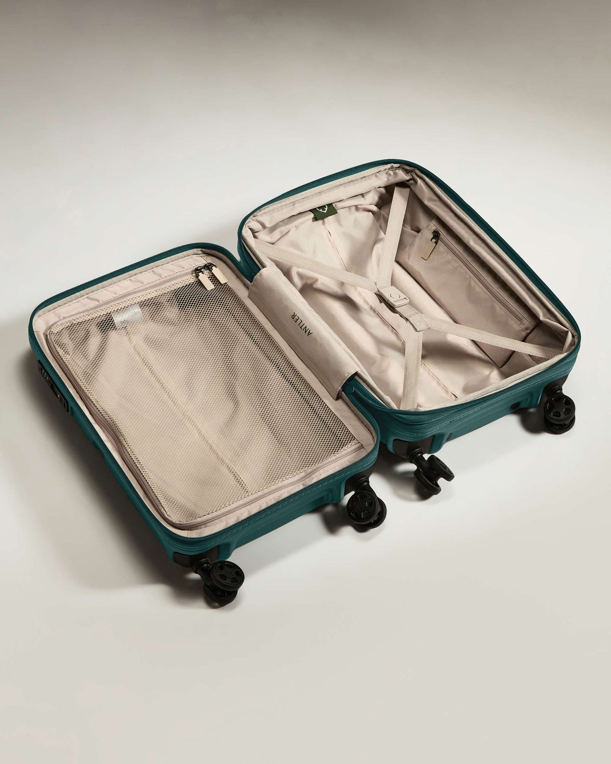 a suitcase with wheels and a mesh inside