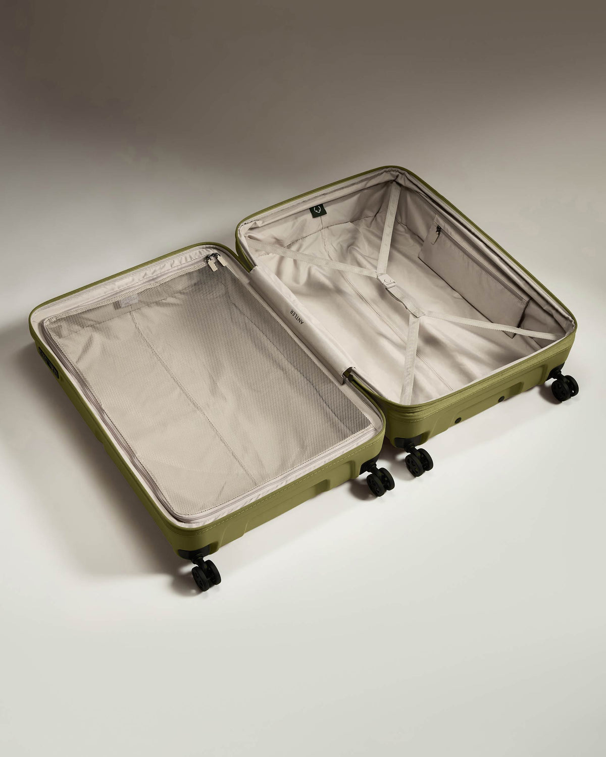 a green suitcase with wheels