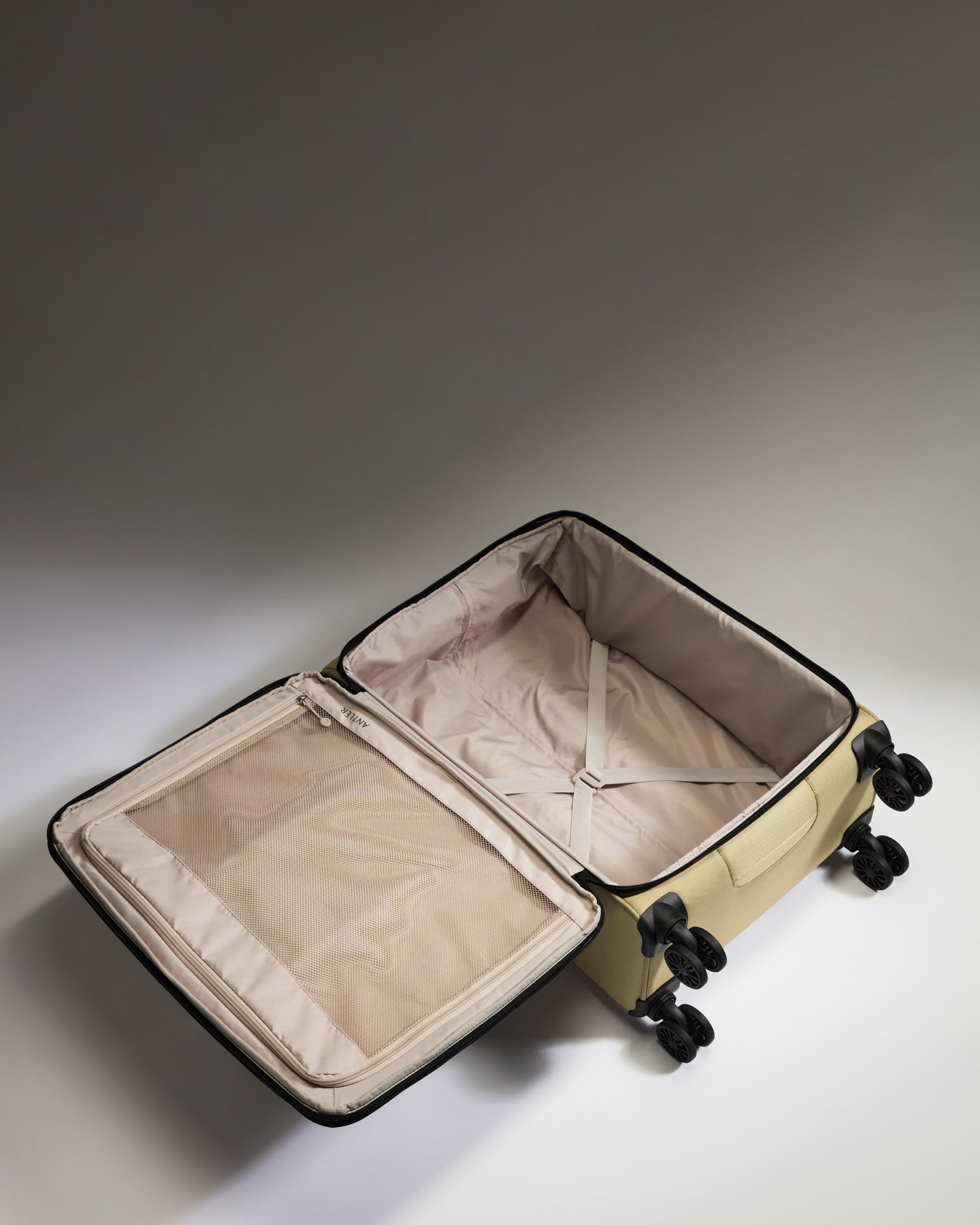 Lightest Medium Luggage in Sand - Soft Stripe 2.0