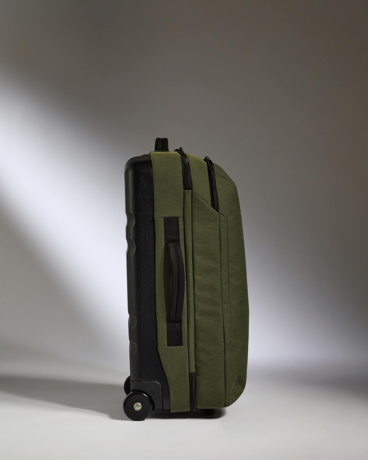 a green suitcase with wheels