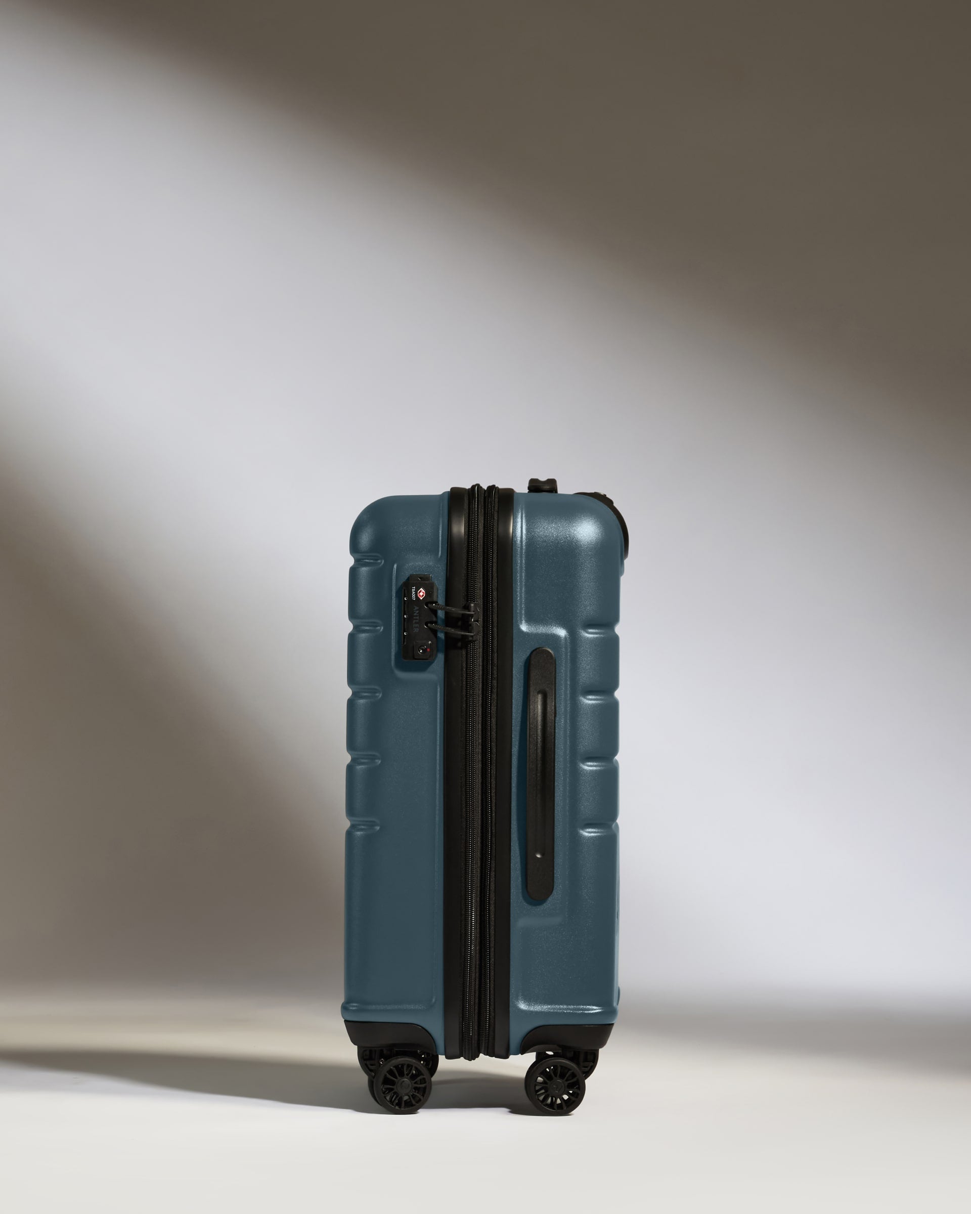 a blue suitcase with wheels