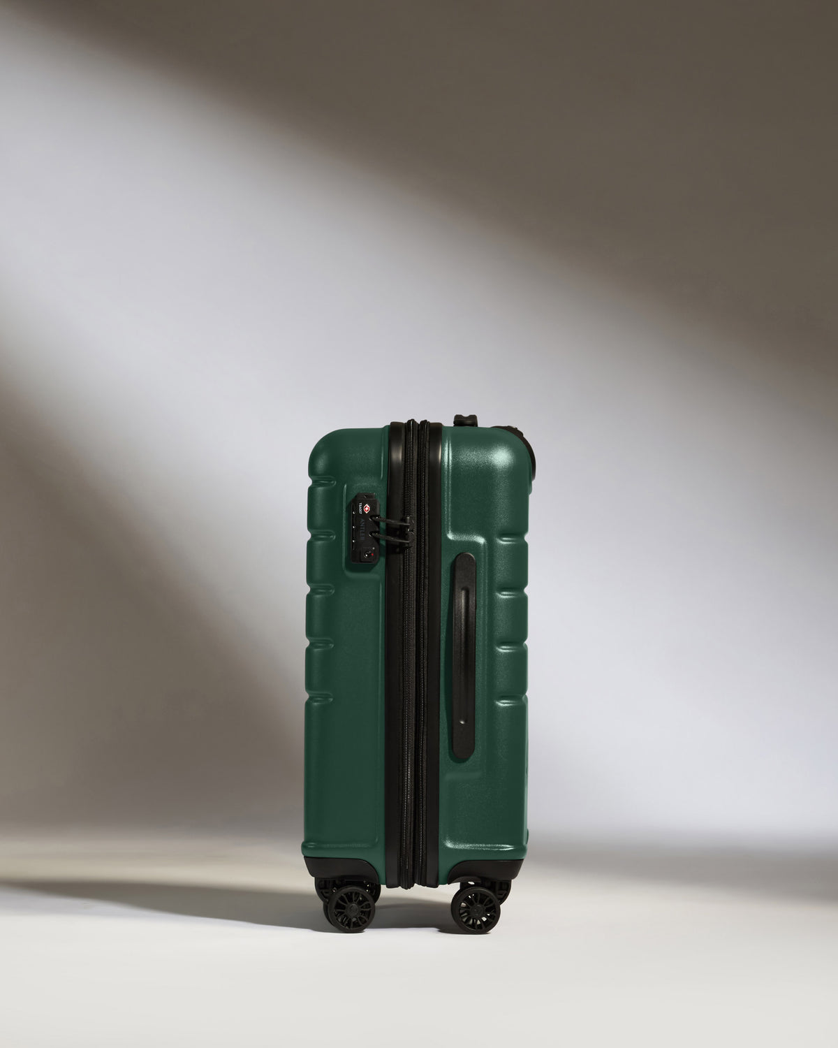 a green suitcase with wheels