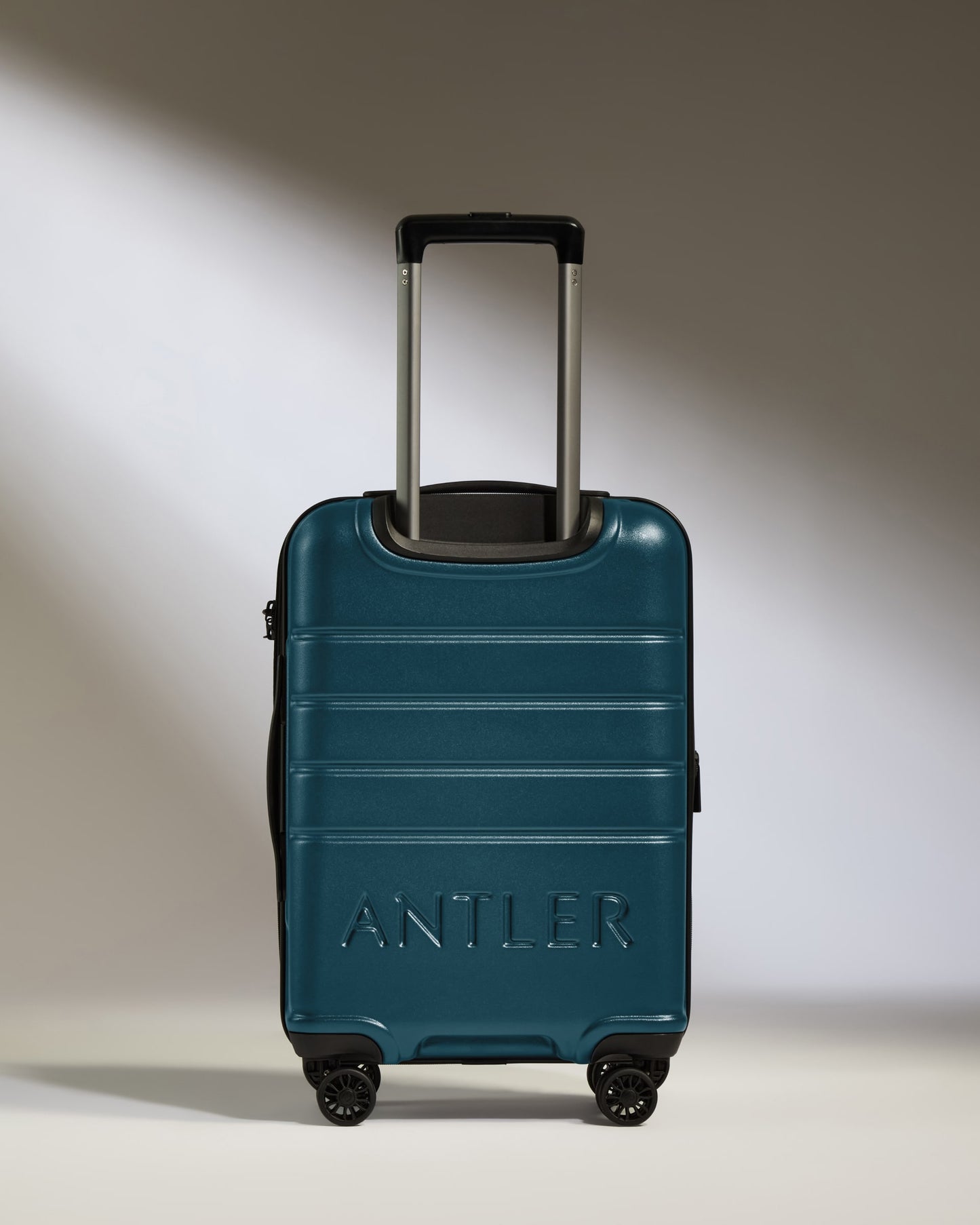 a blue suitcase with handle