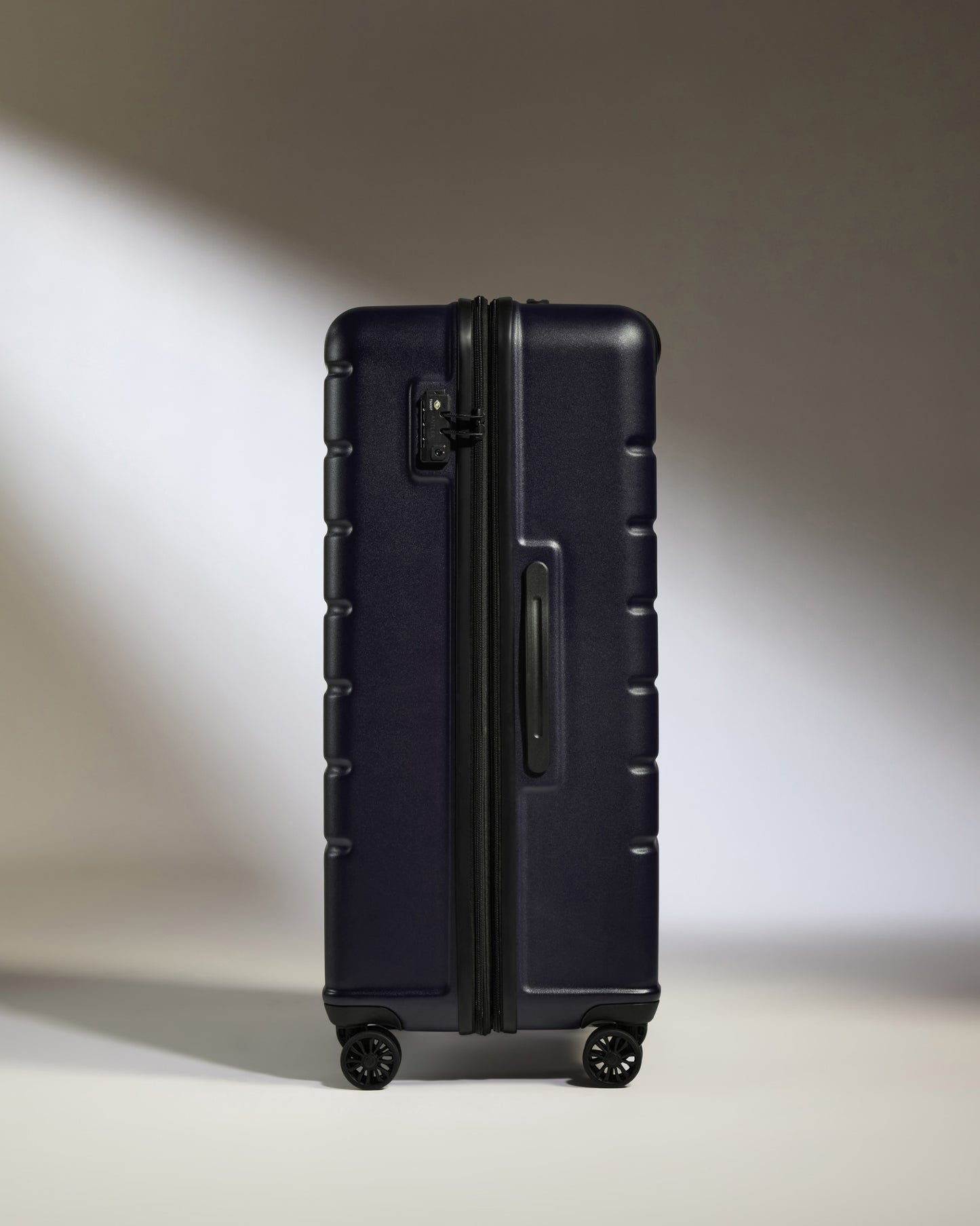 Large Luggage in Dark Purple - Logo