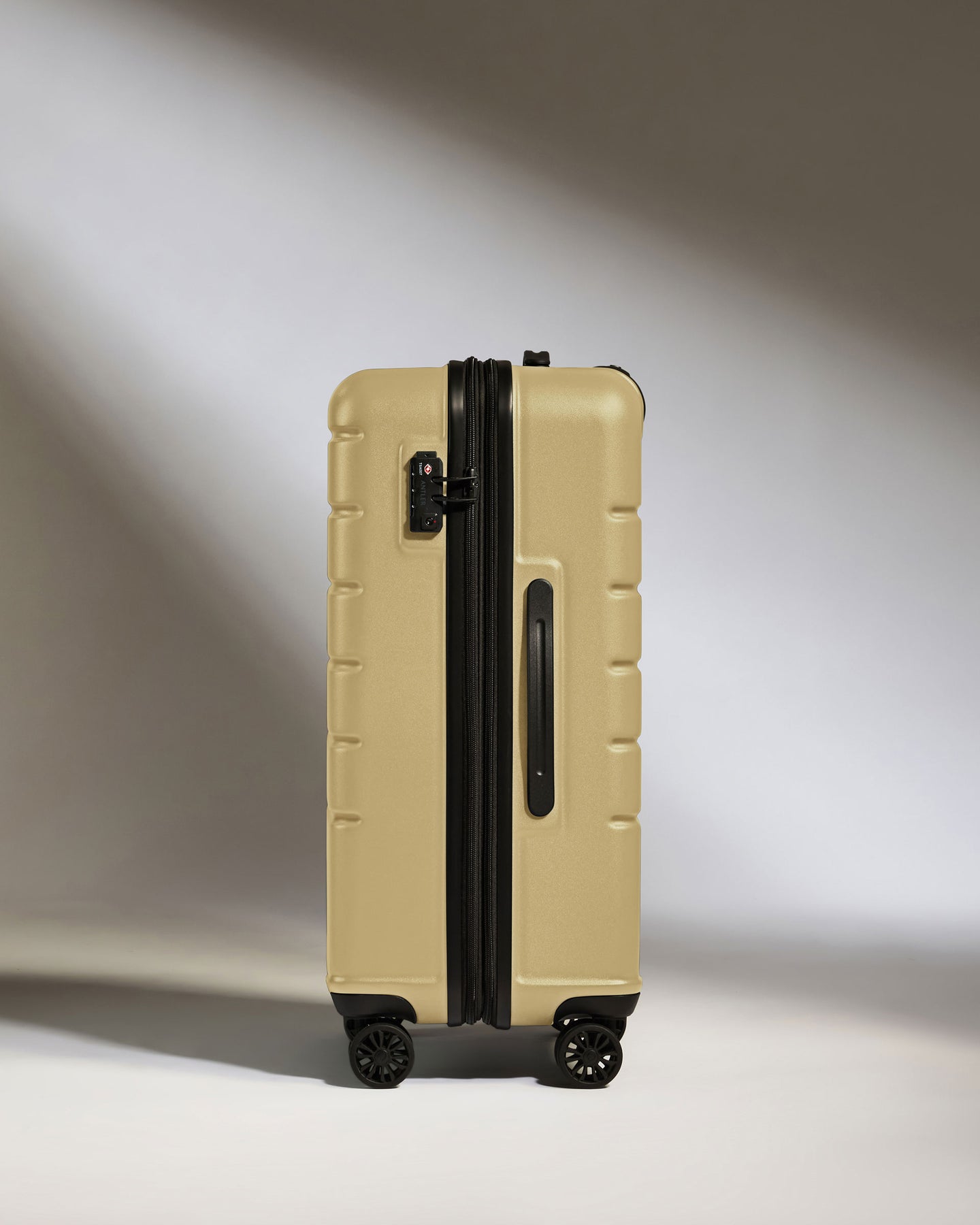 Medium Luggage in Dark Sand - Logo
