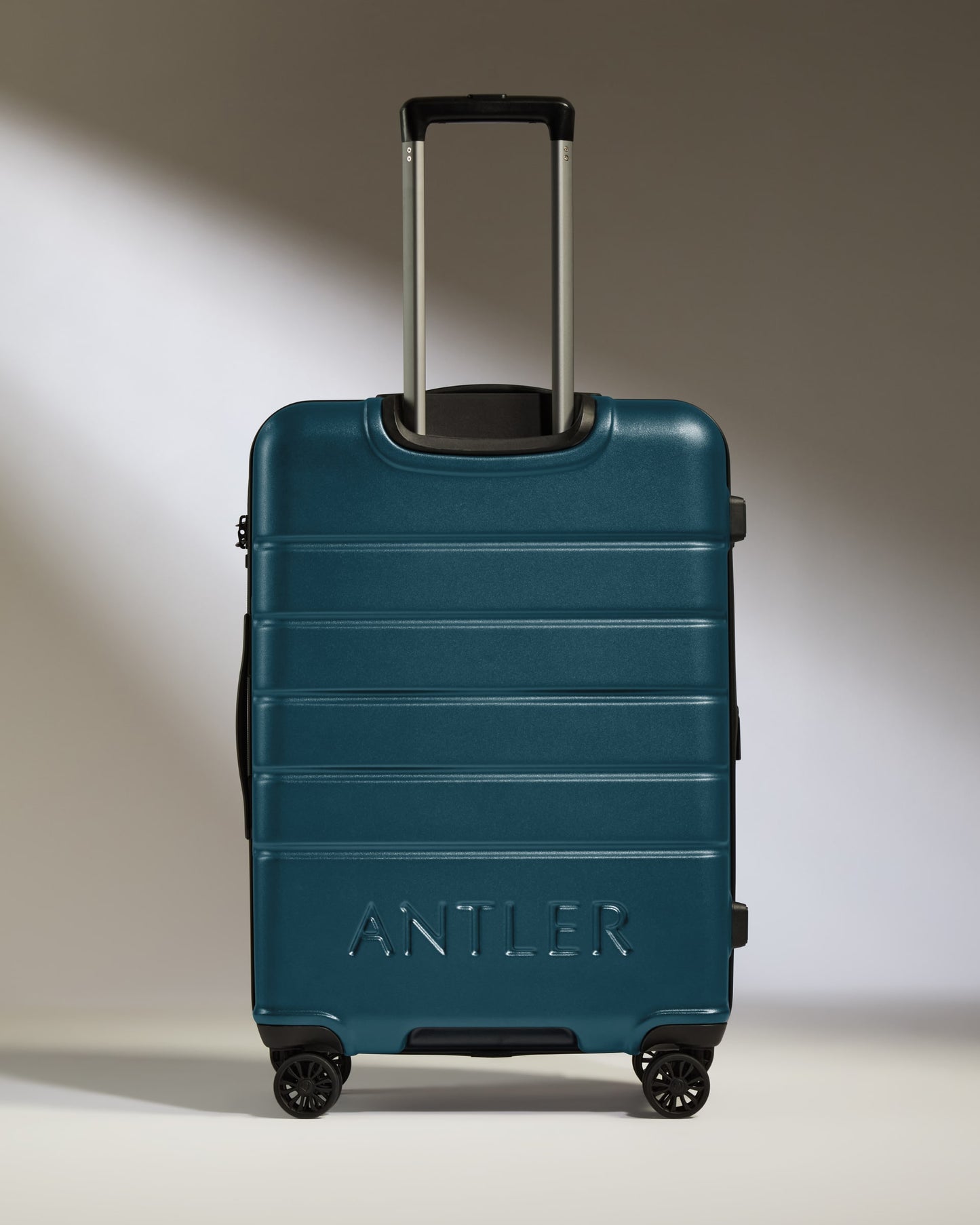 a blue suitcase with handle