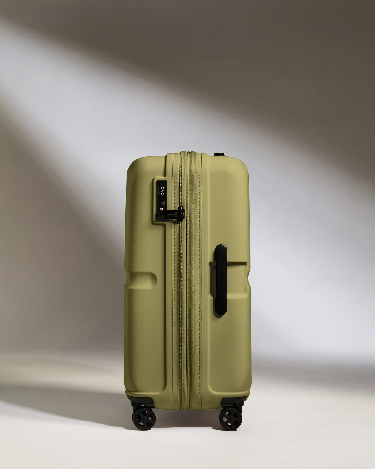 a green suitcase with wheels