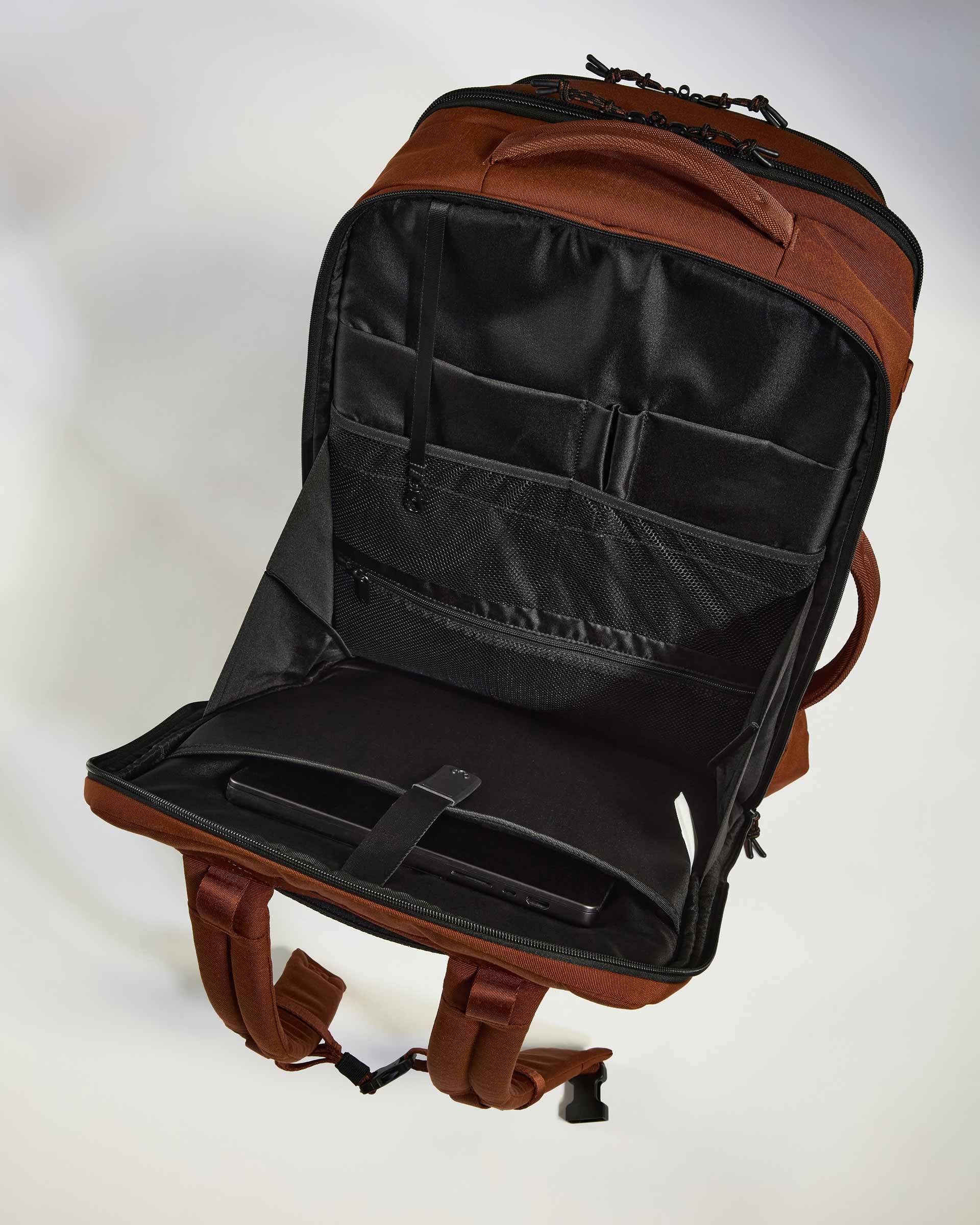 a brown backpack with a black strap