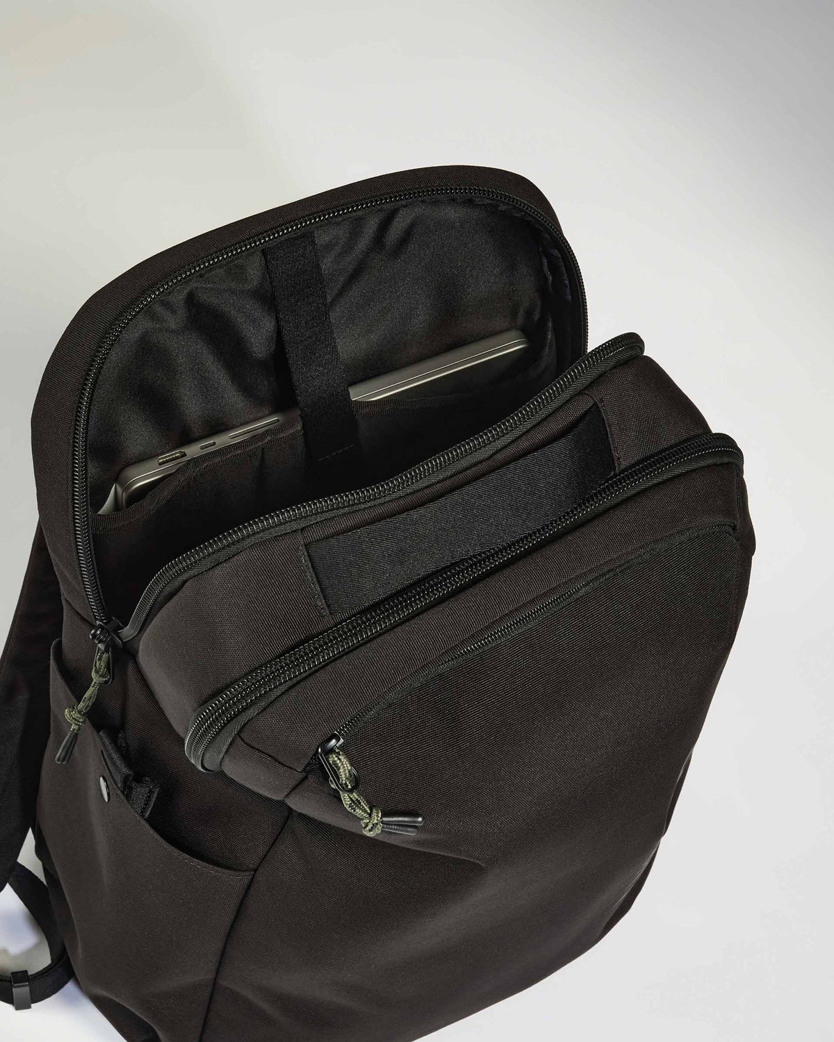 a black backpack with zippers