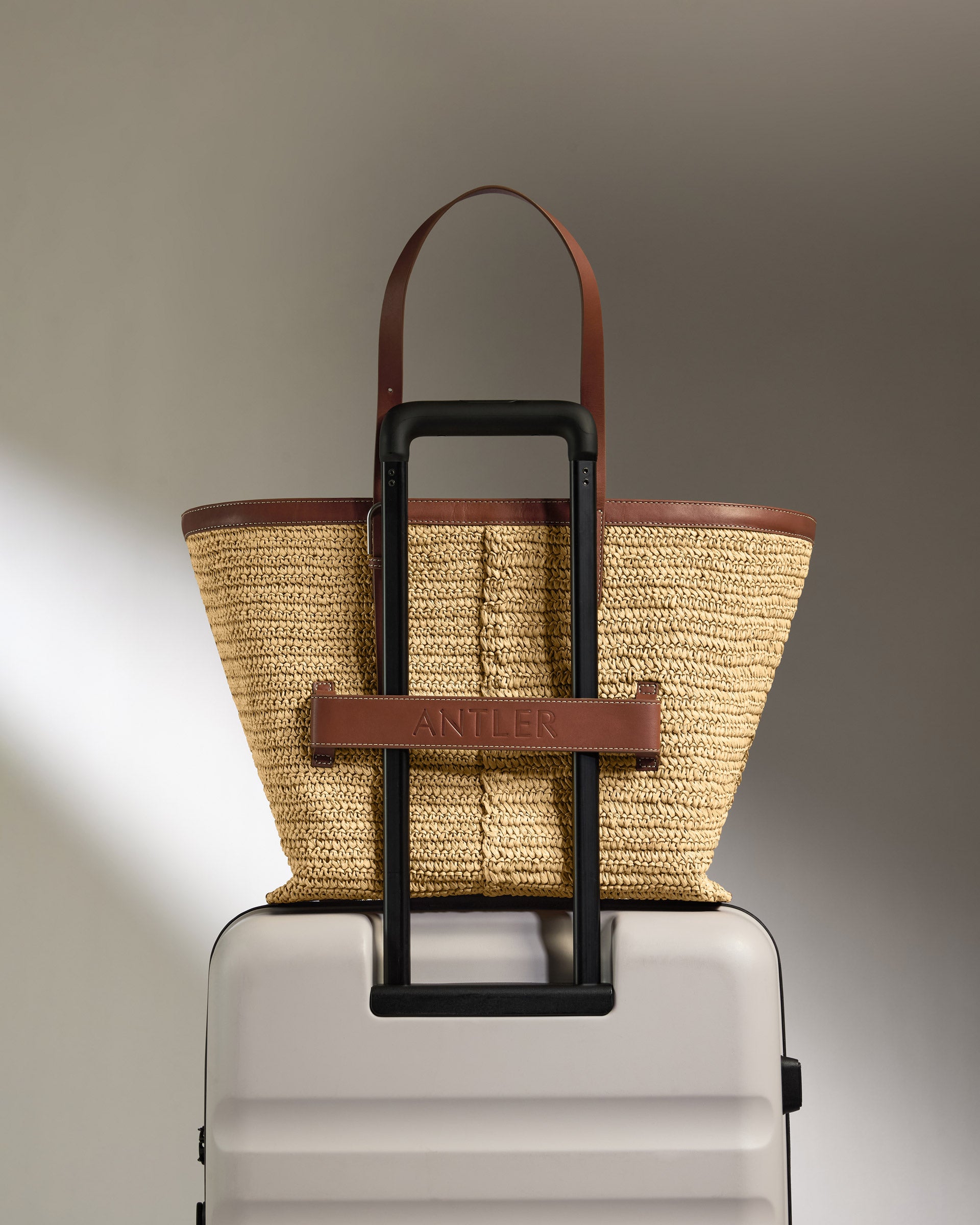 a bag on top of a luggage