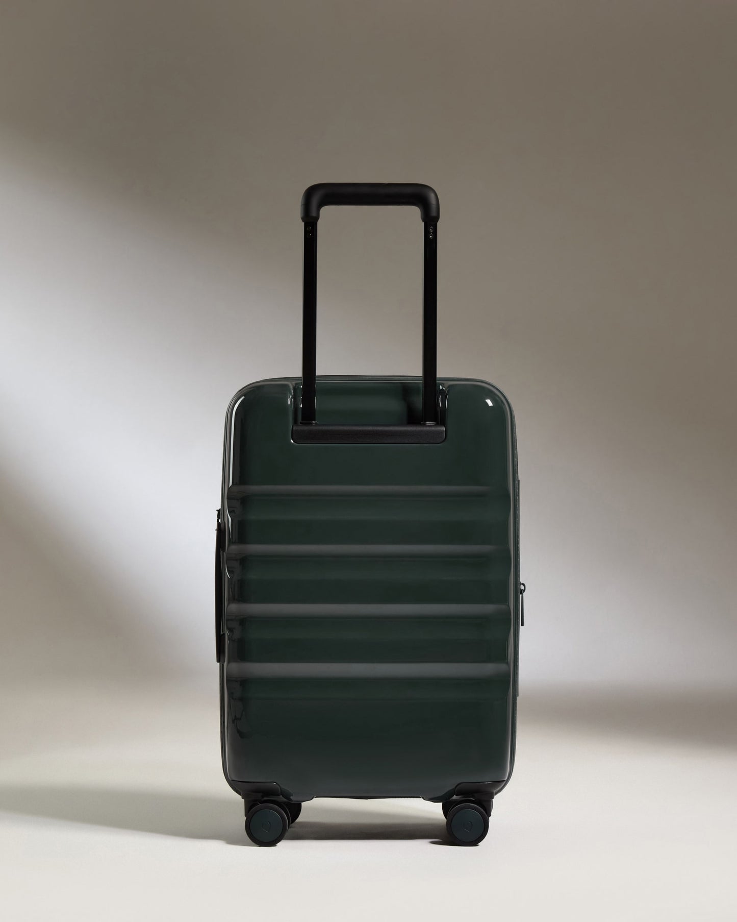 a green suitcase with a handle