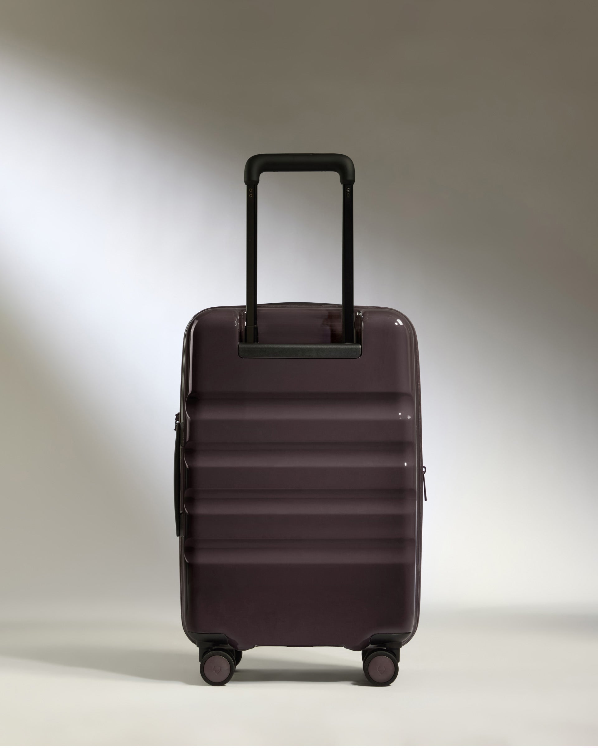 a purple suitcase with wheels
