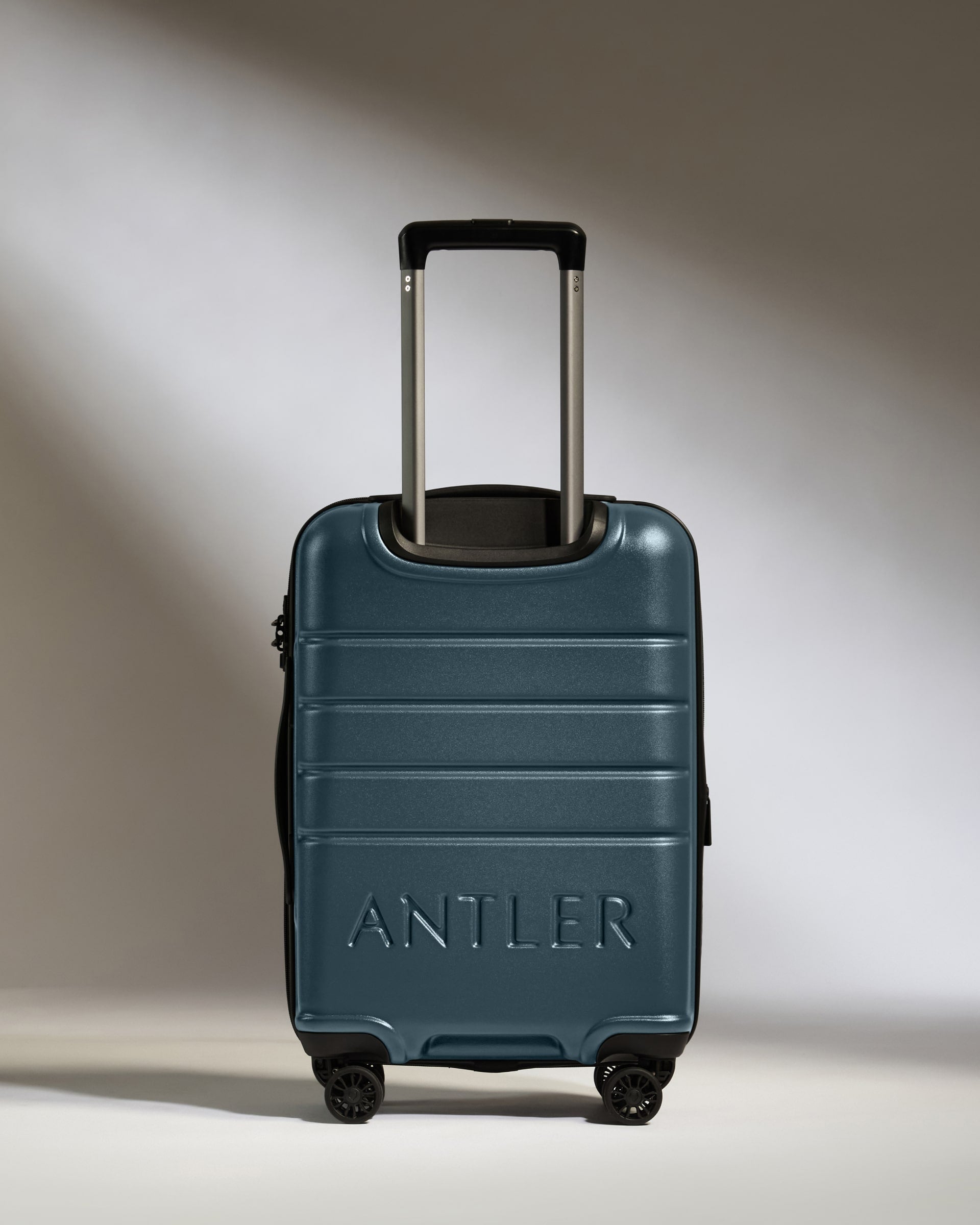 a blue suitcase with handle