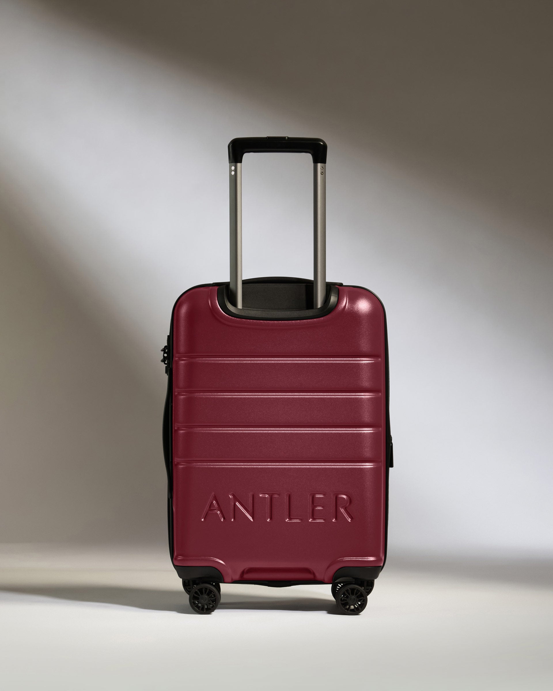 a red suitcase with handle