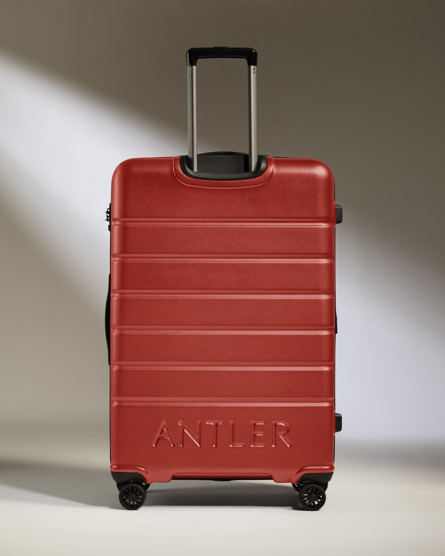 Large Luggage in Red Orange - Logo