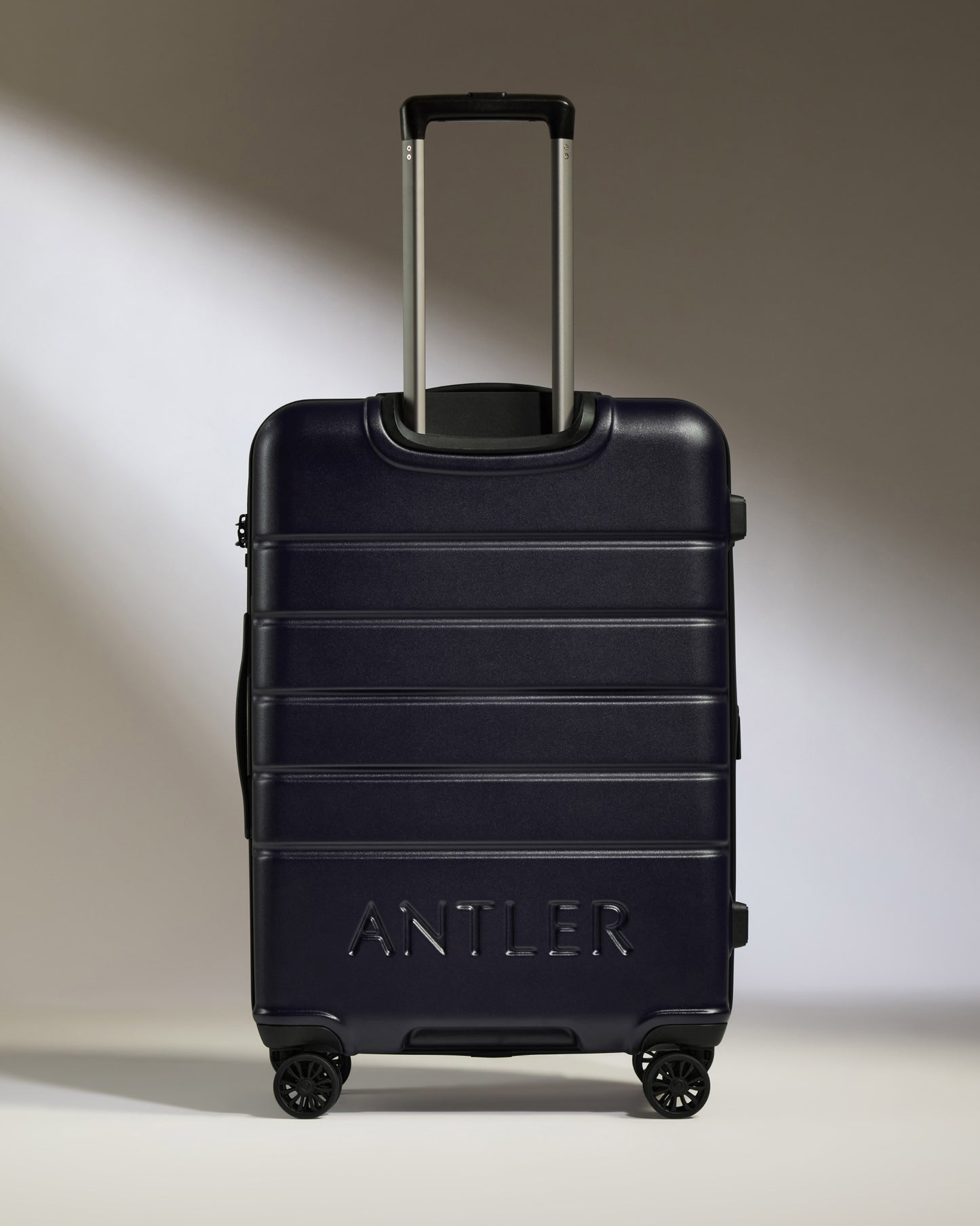 Medium Luggage in Dark Purple - Logo