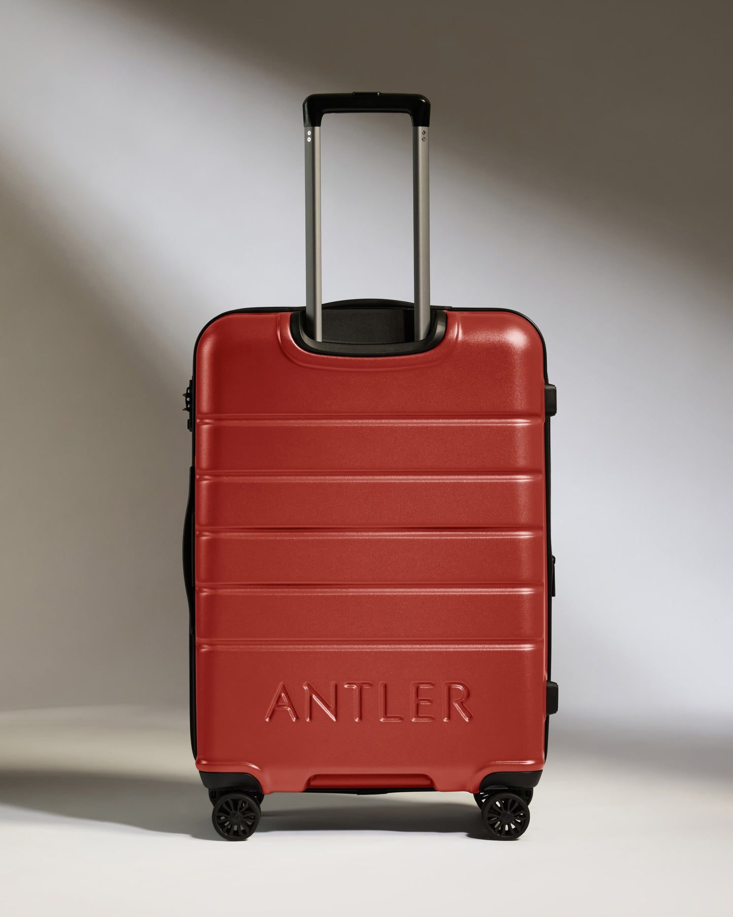 Medium Luggage in Red Orange - Logo