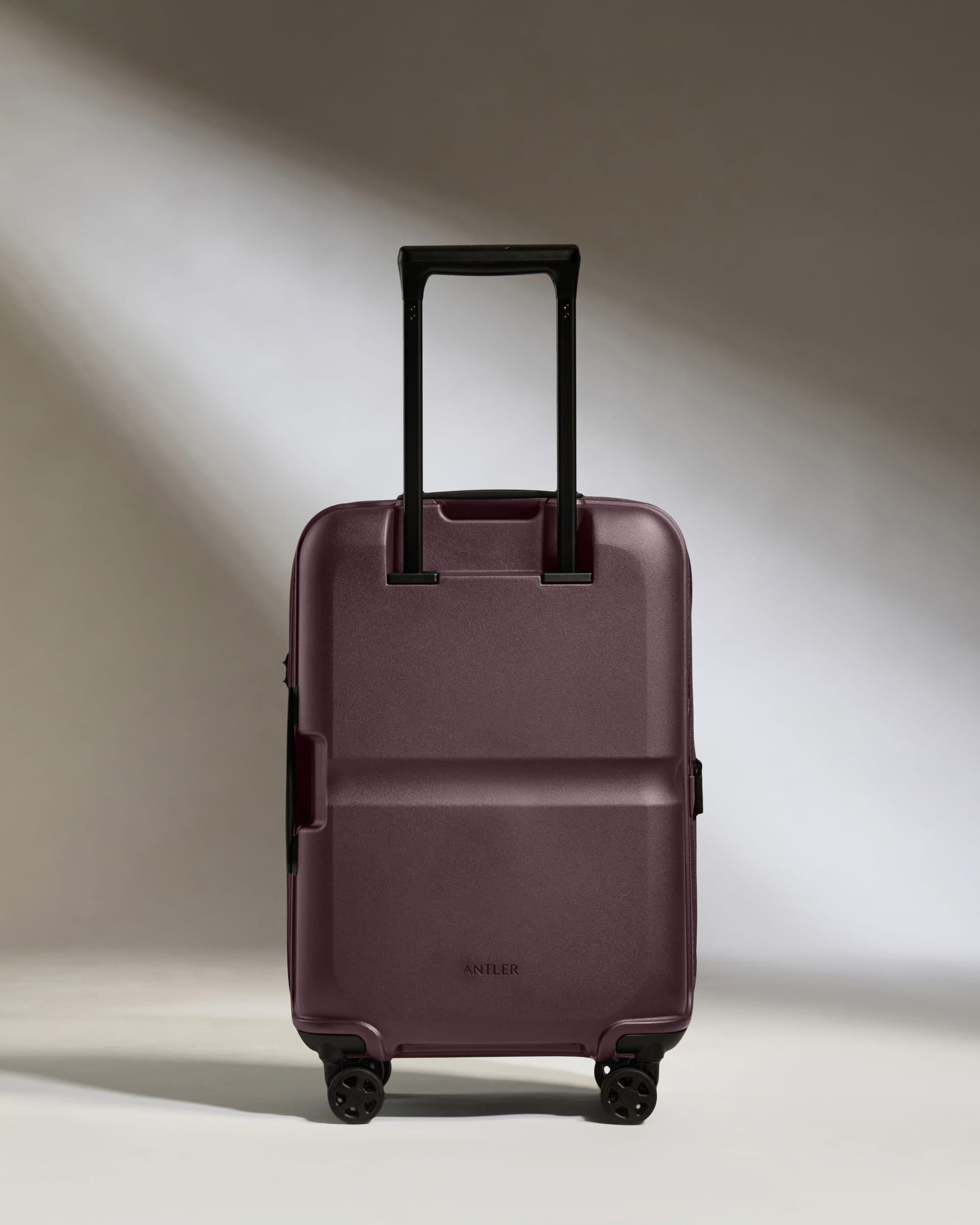 a purple suitcase with wheels