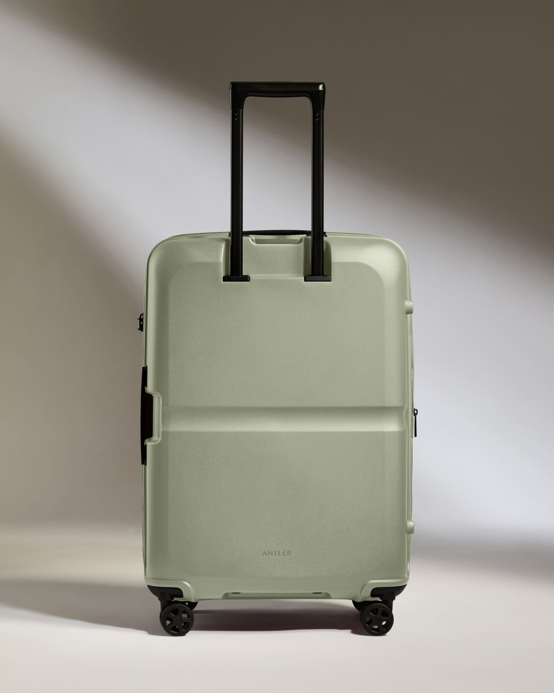 a suitcase with wheels and handle