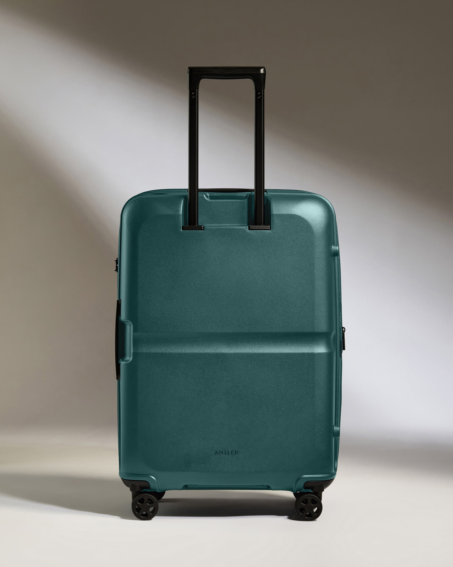 a blue suitcase with black handles