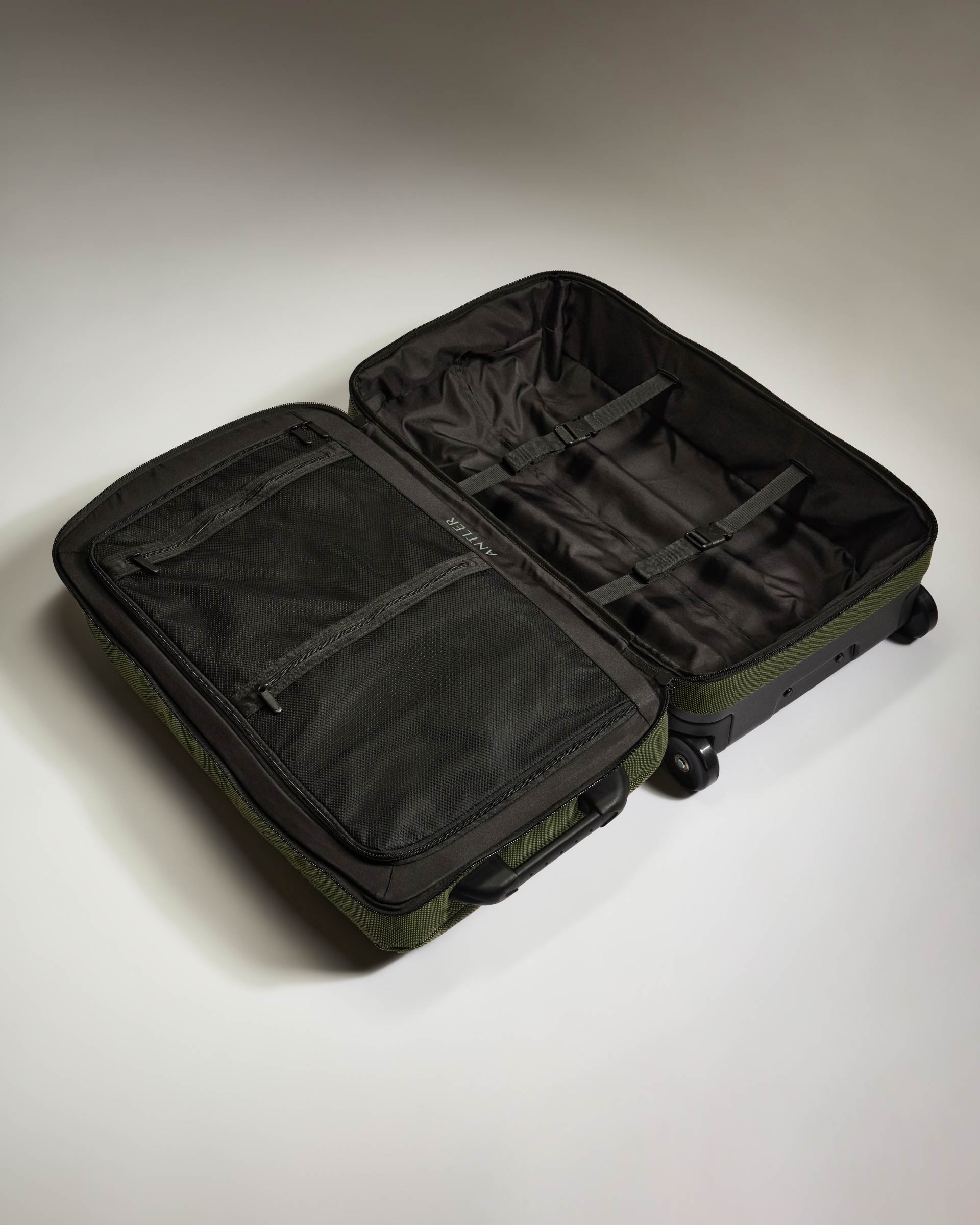 a suitcase with wheels and open lid