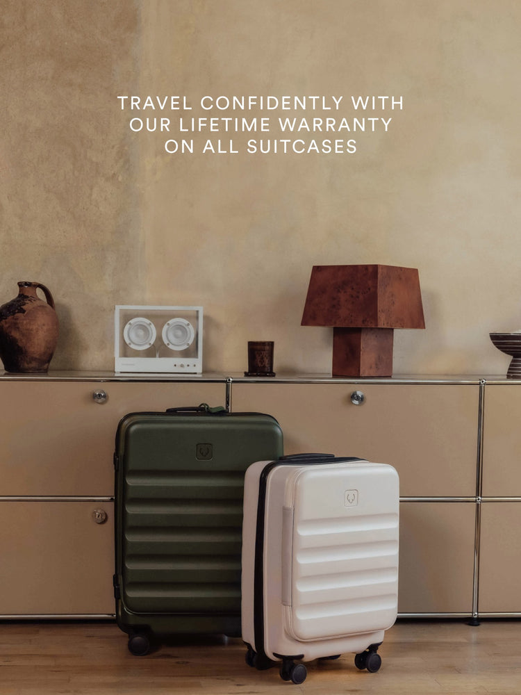 a group of luggage on a shelf