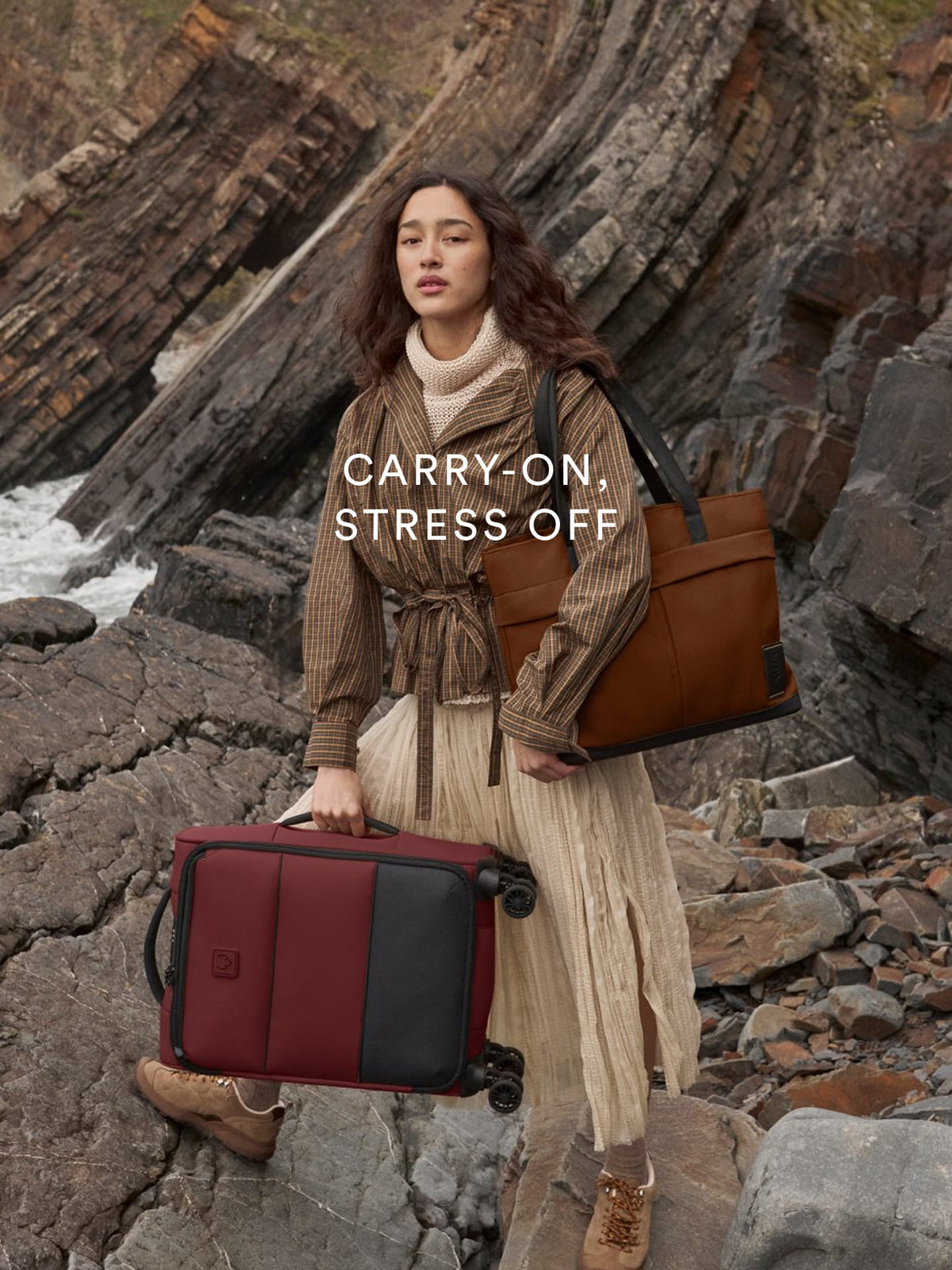 a woman carrying luggage and a bag