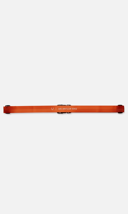 Luggage strap in coral