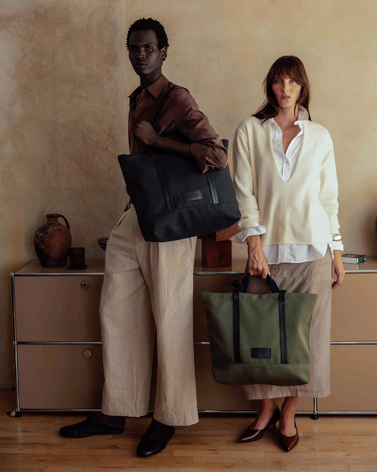 a man and woman holding bags