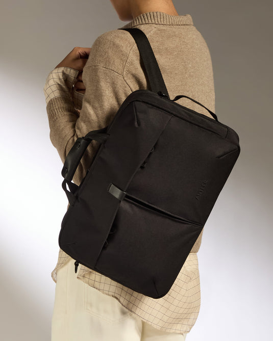 a person with a black bag